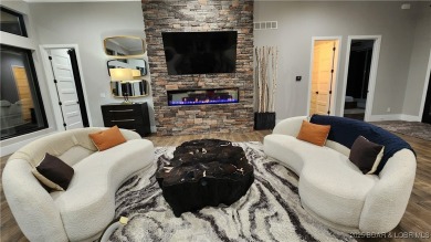 2023 construction, stunning home and is TURNKEY! Stucco & stone on The Club At Porto Cima in Missouri - for sale on GolfHomes.com, golf home, golf lot