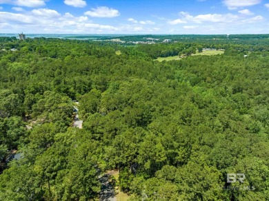 Check out this beautiful wooded lot in the sought-after Lake on Lake Forest Yacht and Country Club in Alabama - for sale on GolfHomes.com, golf home, golf lot