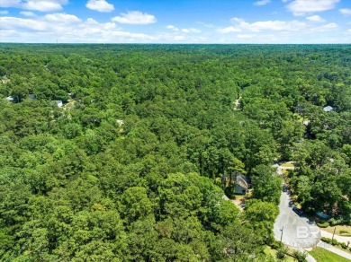 Check out this beautiful wooded lot in the sought-after Lake on Lake Forest Yacht and Country Club in Alabama - for sale on GolfHomes.com, golf home, golf lot