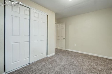 This townhome is ideally located in a quiet neighborhood backing on Country Club of Colorado in Colorado - for sale on GolfHomes.com, golf home, golf lot