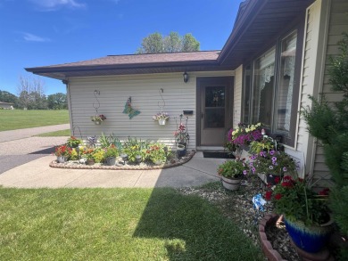 Ranch style stand-alone condo overlooking peaceful hole 4 of on Saddle Ridge Golf Club in Wisconsin - for sale on GolfHomes.com, golf home, golf lot