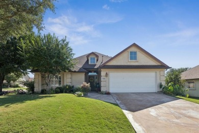 Nestled in a beautifully landscaped setting and shaded by mature on Wildhorse Golf Club of Robson Ranch in Texas - for sale on GolfHomes.com, golf home, golf lot