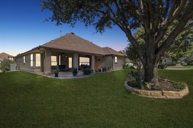 Nestled in a beautifully landscaped setting and shaded by mature on Wildhorse Golf Club of Robson Ranch in Texas - for sale on GolfHomes.com, golf home, golf lot