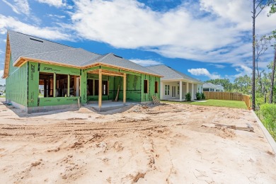 Your next chapter begins in this thoughtfully designed on Origins Golf Club in Florida - for sale on GolfHomes.com, golf home, golf lot