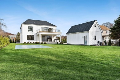 This stunning new custom home offers beautiful water views of on Islands End Golf and Country Club, Inc. in New York - for sale on GolfHomes.com, golf home, golf lot