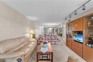 Welcome to this charming 55+ condo featuring tile flooring in on Wynmoor Golf Course in Florida - for sale on GolfHomes.com, golf home, golf lot