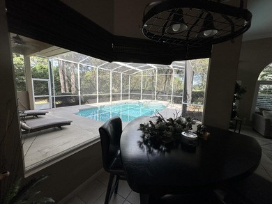 Enjoy the exceptional location of 472 Indigo Loop within the on Emerald Bay Golf Club in Florida - for sale on GolfHomes.com, golf home, golf lot