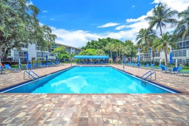 Welcome to this charming 55+ condo featuring tile flooring in on Wynmoor Golf Course in Florida - for sale on GolfHomes.com, golf home, golf lot