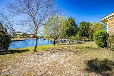 Experience unparalleled waterfront living in this extraordinary on Harbour Point Golf Club in North Carolina - for sale on GolfHomes.com, golf home, golf lot