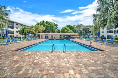 Welcome to this charming 55+ condo featuring tile flooring in on Wynmoor Golf Course in Florida - for sale on GolfHomes.com, golf home, golf lot