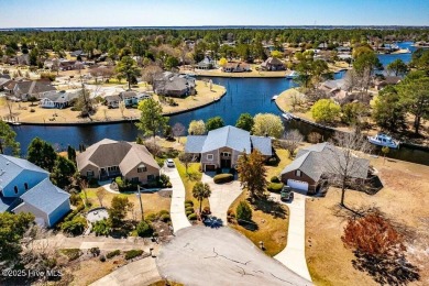 Experience unparalleled waterfront living in this extraordinary on Harbour Point Golf Club in North Carolina - for sale on GolfHomes.com, golf home, golf lot