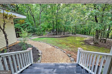 Nestled in Burton Getaways Community, this charming Fee Simple on Waterfall Country Club in Georgia - for sale on GolfHomes.com, golf home, golf lot