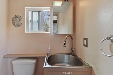 Discover warmth and comfort with this beautifully upgraded pool on Heartwell Golf Course in California - for sale on GolfHomes.com, golf home, golf lot