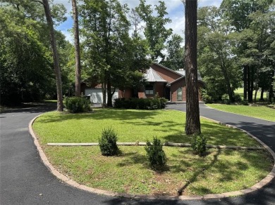 Great curb appeal on this 3BD-3BA Golf Course Home at Holly Lake on Holly Lake Ranch Golf Club in Texas - for sale on GolfHomes.com, golf home, golf lot