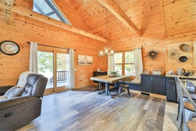 Enjoy relaxing on the large 10x30 deck overlooking the 11th hole on Hardwoods Golf Club At Mille Lacs in Minnesota - for sale on GolfHomes.com, golf home, golf lot