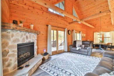 Enjoy relaxing on the large 10x30 deck overlooking the 11th hole on Hardwoods Golf Club At Mille Lacs in Minnesota - for sale on GolfHomes.com, golf home, golf lot