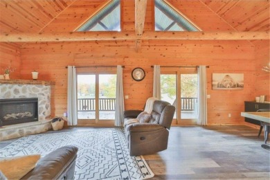 Enjoy relaxing on the large 10x30 deck overlooking the 11th hole on Hardwoods Golf Club At Mille Lacs in Minnesota - for sale on GolfHomes.com, golf home, golf lot