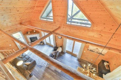 Enjoy relaxing on the large 10x30 deck overlooking the 11th hole on Hardwoods Golf Club At Mille Lacs in Minnesota - for sale on GolfHomes.com, golf home, golf lot