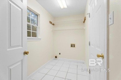 Step into this spacious 5-bedroom, 2.5-bath home where a on Lake Forest Yacht and Country Club in Alabama - for sale on GolfHomes.com, golf home, golf lot