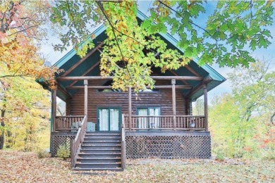 Enjoy relaxing on the large 10x30 deck overlooking the 11th hole on Hardwoods Golf Club At Mille Lacs in Minnesota - for sale on GolfHomes.com, golf home, golf lot