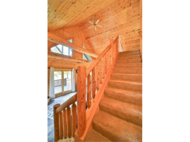 Enjoy relaxing on the large 10x30 deck overlooking the 11th hole on Hardwoods Golf Club At Mille Lacs in Minnesota - for sale on GolfHomes.com, golf home, golf lot