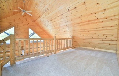 Enjoy relaxing on the large 10x30 deck overlooking the 11th hole on Hardwoods Golf Club At Mille Lacs in Minnesota - for sale on GolfHomes.com, golf home, golf lot