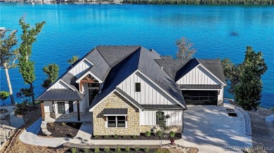 Dive into luxury at this breathtaking new build in Porto Cima on The Club At Porto Cima in Missouri - for sale on GolfHomes.com, golf home, golf lot