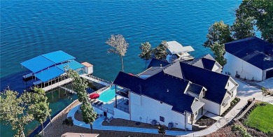 Dive into luxury at this breathtaking new build in Porto Cima on The Club At Porto Cima in Missouri - for sale on GolfHomes.com, golf home, golf lot