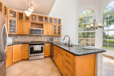 Experience the ultimate Doral lifestyle in this stunning 5BR/3BA on Jim McLean Signature Course in Florida - for sale on GolfHomes.com, golf home, golf lot