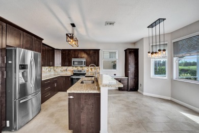 Located on a quiet, tree-lined street and surrounded by lush on The Links At Madison Green in Florida - for sale on GolfHomes.com, golf home, golf lot