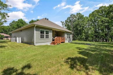 Built in 2024, this home sits on .29 acre lot minutes from I49 on Bella Vista Country Club - Highlands in Arkansas - for sale on GolfHomes.com, golf home, golf lot