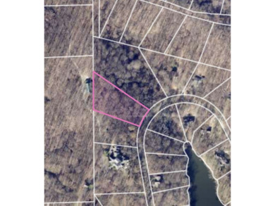 This exceptional parcel of land is situated within the highly on Foxcliff Golf Club in Indiana - for sale on GolfHomes.com, golf home, golf lot