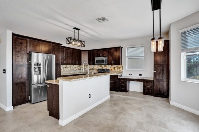 Located on a quiet, tree-lined street and surrounded by lush on The Links At Madison Green in Florida - for sale on GolfHomes.com, golf home, golf lot
