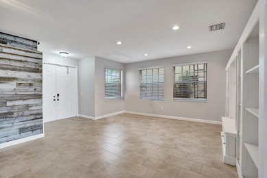 Located on a quiet, tree-lined street and surrounded by lush on The Links At Madison Green in Florida - for sale on GolfHomes.com, golf home, golf lot