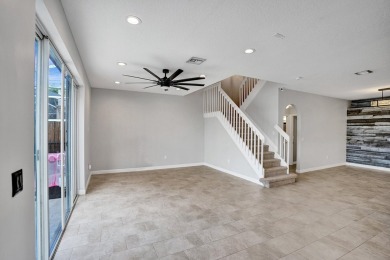 Located on a quiet, tree-lined street and surrounded by lush on The Links At Madison Green in Florida - for sale on GolfHomes.com, golf home, golf lot