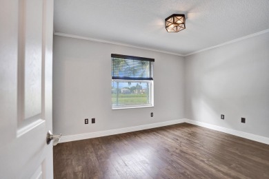Located on a quiet, tree-lined street and surrounded by lush on The Links At Madison Green in Florida - for sale on GolfHomes.com, golf home, golf lot