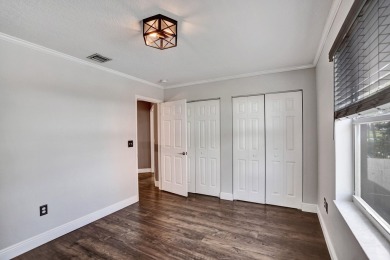 Located on a quiet, tree-lined street and surrounded by lush on The Links At Madison Green in Florida - for sale on GolfHomes.com, golf home, golf lot
