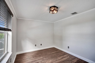 Located on a quiet, tree-lined street and surrounded by lush on The Links At Madison Green in Florida - for sale on GolfHomes.com, golf home, golf lot