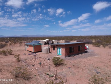 This super cute, fully sustainable off-grid home is completely on City of Douglas Municipal Golf Course in Arizona - for sale on GolfHomes.com, golf home, golf lot