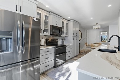 This truly spectacular Walk-in level Waterfront condo. Has on Seasons Ridge At Four Seasons in Missouri - for sale on GolfHomes.com, golf home, golf lot