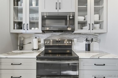 This truly spectacular Walk-in level Waterfront condo. Has on Seasons Ridge At Four Seasons in Missouri - for sale on GolfHomes.com, golf home, golf lot