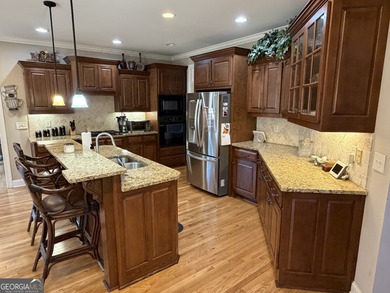 Beautifully positioned on the golf course, this four-sided brick on Canongate At Heron Bay in Georgia - for sale on GolfHomes.com, golf home, golf lot