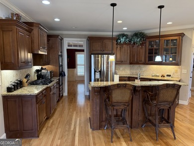 Beautifully positioned on the golf course, this four-sided brick on Canongate At Heron Bay in Georgia - for sale on GolfHomes.com, golf home, golf lot