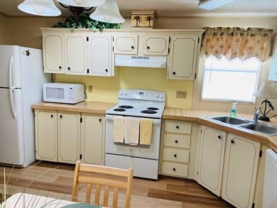 This home is in a 55 plus community with a monthly lot rent of on Crystal Lake Club in Florida - for sale on GolfHomes.com, golf home, golf lot