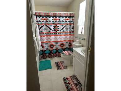 Charming 2-Bedroom Home with Sunroom in a Wonderful on Schalamar Creek Golf and Country Club in Florida - for sale on GolfHomes.com, golf home, golf lot