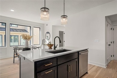 Discover modern, low-maintenance luxury living in this stunning on The Golf Club of Kansas in Kansas - for sale on GolfHomes.com, golf home, golf lot