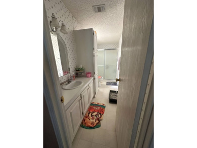 Charming 2-Bedroom Home with Sunroom in a Wonderful on Schalamar Creek Golf and Country Club in Florida - for sale on GolfHomes.com, golf home, golf lot