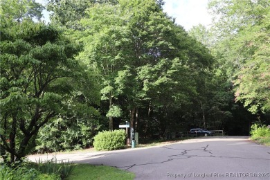 Experience the best of Carolina Trace living! This wooded corner on Carolina Trace Country Club in North Carolina - for sale on GolfHomes.com, golf home, golf lot