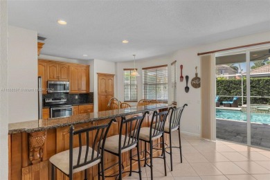 Beautiful 5/4 pool home in the A+ school district and highly on Weston Hills Country Club in Florida - for sale on GolfHomes.com, golf home, golf lot