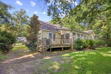 Nestled on a quiet cul-de-sac in The Bluffs at Pawleys Island on Pawleys Plantation Golf and Country Club in South Carolina - for sale on GolfHomes.com, golf home, golf lot